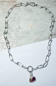 Handmade sterling silver chain set with a rose cut tourmaline. Length 18 inches